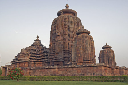 Ancient Hindu Temple (Brahmesvara Temple). Ornately carved building with multiple towers inside a walled compound. Bhubaneswar Orissa India. 11th Century ADの写真素材