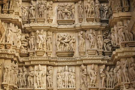 Erotic sculptures decorating the ancient Vishvanath Hindu Temple at Khajuraho Uttar Pradesh India. 11th Century AD.の写真素材