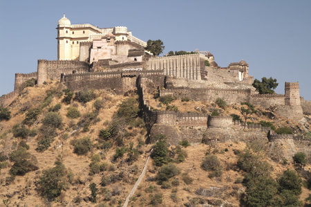 Huge 15th century fortress at Kumbhalgarh, Rajasthan, India. Royal palace sitting on the peak of a...