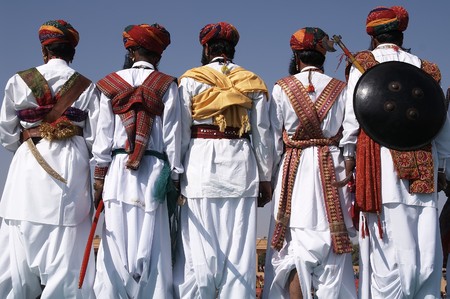Men in traditional Rajasthani dress with shields and axes. Jaisalmer Indiaの写真素材