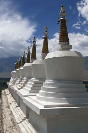 Row of stupas topped with gold crowns at Shey Buddhist monastery. Leh, Ladakh, Indiaの写真素材
