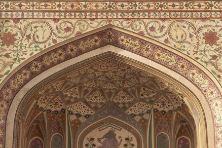 Detail of ornately decorated gateway (Ganesh Pol) inside Amber Palace Jaipur Rajasthan Indiaの写真素材