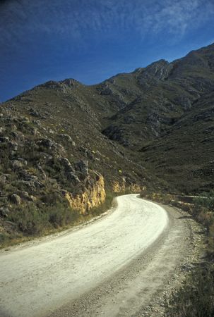 Curved gravel road of the Swartberg Pass in the Western Cape, South Africaの写真素材