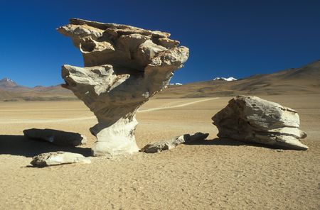 Natural stone sculpture ARBOL DE PIEDRA or tree of stone high in the Bolivian Altiplano, Bolivia, South Americaの写真素材