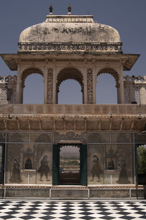 Painted murals on the walls of a Rajput style courtyard inside the City Palace, Udaipur, Indiaの写真素材