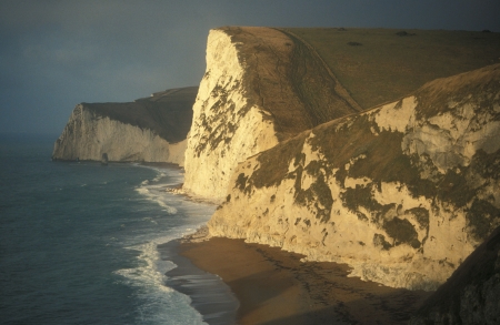 Chalk cliffs meet the sea along the Dorset Coast, Englandの写真素材