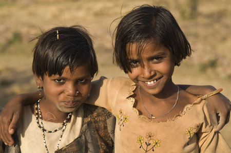Orchha, India - March 27, 2007: Happy smiling sisters from a poor Indian family in Orchha, Madhya Pradesh, Indiaのeditorial素材