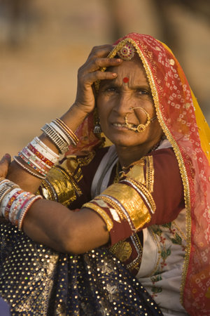 Pushkar, Rajasthan, India - November 9, 2008: Indian lady in traditional tribal dress at the annual...