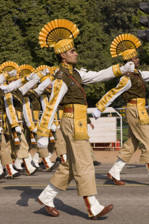 Delhi, India - January 20, 2008: Soldiers in bright yellow trim parading down the Raj Path in...