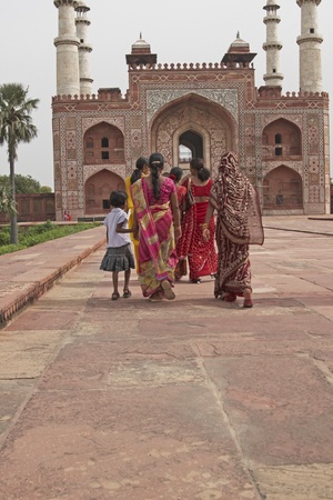Agra, India - July 25, 2008: Indian family in brightly colored clothing at the tomb of the Mughal Emperor, Akbar in Agra, Uttar Pradesh, India.のeditorial素材