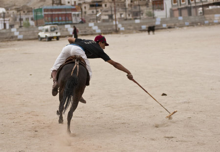 Leh, Ladakh, India - August 22, 2008: Polo match being played on a dusty pitch in Leh, Ladakh, India