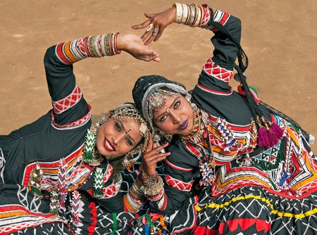 Haryana, India - February 12, 2009: Kalbelia dancers in ornate black costume trimmed with beads and sequins at the Sarujkund Fair near Delhi in Indiaのeditorial素材