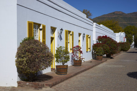 Historic architecture in Graaff-Reinet, Eastern Cape, South Africa  White building in Cape Dutch style with colorfully painted window frames のeditorial素材