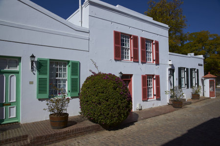 Historic architecture in Graaff-Reinet, Eastern Cape, South Africa  White building in Cape Dutch style with colorfully painted window frames のeditorial素材