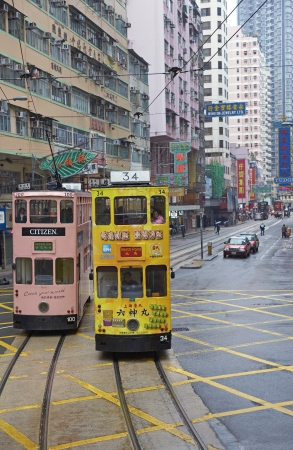 Hong Kong - 25 January 2012: Colorful trams on Hong Kong Island in Hong Kongのeditorial素材