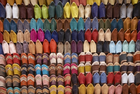 Colorful display of traditional leather slippers for sale in the souk of Fes in Morocco の写真素材