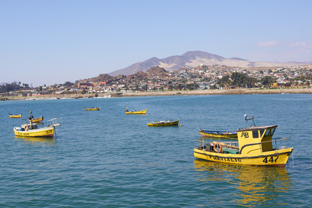 Huasco, Chile - May 30, 2014  Small inshore fishing boats in the bay at Huasco off the coast of the Atacama Desert in Chileのeditorial素材
