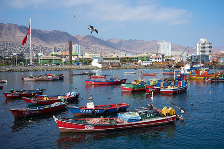 Antofagasta, Chile - June 21, 2014  Colourful wooden fishing boats in the harbour at Antofagasta in the Atacama Region of Chileのeditorial素材