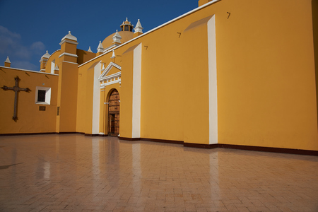 Bright yellow colonial style Cathedral in the Plaza de Armas of Trujillo, Peru