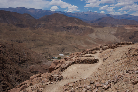 Archeological site with remains of the historic fortress of Pukara de Copaquilla in the Andes Mountains of northern Chile.のeditorial素材