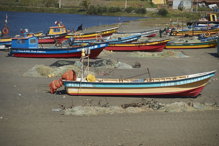 Curanipe, Chile - November 15, 2014: Colourful wooden fishing boats on the beach in the small coastal town of Curanipe in Maule, Chileのeditorial素材