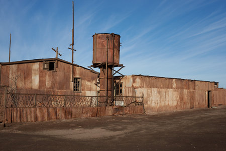 Humberstone, Chile - July 1, 2015: Derelict and rusting industrial buildings at the historic Humberstone Saltpeter Works in the Atacama Desert near Iquique in Chile. The site is now an open air museum and a Unesco World Heritage SIte.のeditorial素材