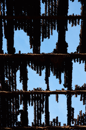 Humberstone, Chile - July 1, 2015: Derelict and rusting corrugated iron roof at the historic Humberstone Saltpeter Works in the Atacama Desert near Iquique in Chile. The site is now an open air museum and a Unesco World Heritage SIte.のeditorial素材