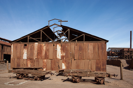 Santa Laura, Chile - July 1, 2015: Derelict and rusting buildings at the historic Santa Laura Saltpeter Works in the Atacama Desert near Iquique in Chile. The site is now an open air museum and a Unesco World Heritage SIte.のeditorial素材