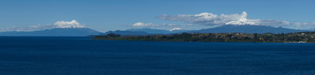 Snow capped Volcanoes Osorno 2,652 metres and Calbuco 2,105 metres on the edge of Llanquihue Lake in Southern Chile. Viewed from Puerto Varas.のeditorial素材