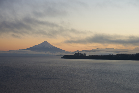 Sunrise over Snow capped Volcano Osorno 2,652 metres on the edge of Llanquihue Lake in Southern Chile. Viewed from Puerto Varas.のeditorial素材