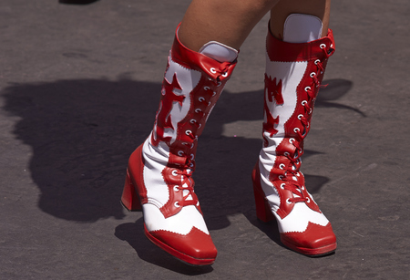 Colourful red and white boots of a dancer performing the Diablada dance of the devil as part of the Carnaval Andino con la Fuerza del Sol in Arica, Chile. The dance originates in Oruro, Boliviaのeditorial素材