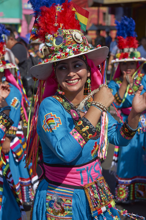 ARICA, CHILE - JANUARY 22, 2016: Tinku dancing group in colourful costumes performing a traditional ritual dance as part of the Carnaval Andino con la Fuerza del Sol in Arica, Chile.のeditorial素材