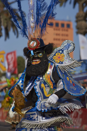 ARICA, CHILE - JANUARY 24, 2016: Morenada dancer in traditional Andean costume performing at the annual Carnaval Andino con la Fuerza del Sol in Arica, Chile.のeditorial素材