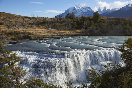 The waterfall "Cascada Paine" on the River Paine in Torres del Paine National Park in the Magallanes region of southern Chile.の写真素材