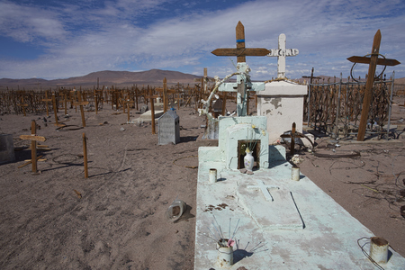 ATACAMA DESERT, CHILE - MAY 6, 2016: Historic graveyard in the Atacama Desert of northern Chile containing the graves of miners who worked extracting saltpeter.のeditorial素材