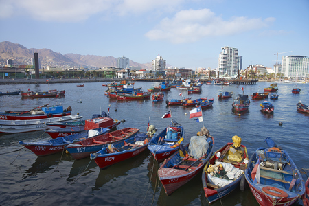 ANTOFAGASTA, CHILE - MAY 16, 2016: Colourful fishing boats in the harbour of Antofagasta on the Pacific coast of Chile.のeditorial素材