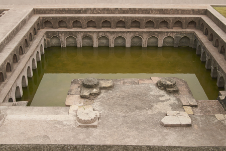 MANDU, MADHYA PRADESH, INDIA - NOVEMBER 18, 2008: Ornate bathing pool at the ancient islamic royal palace of Jahaz Mahal. Mandu, Madhya Pradesh, India. 16th Century ADのeditorial素材
