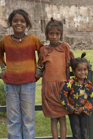MANDU, MADHYA PRADESH, INDIA - NOVEMBER 18, 2008: Group of three children in the hilltop town of Mandu in Madhya Pradesh, India.のeditorial素材