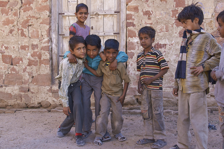 NAGAUR, RAJASTHAN, INDIA - FEBRUARY 14, 2008: Playful group of children in the backstreets of Nagaur in India.のeditorial素材