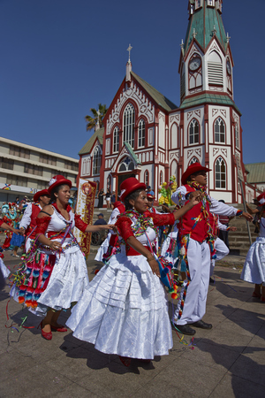 ARICA, CHILE - FEBRUARY 10, 2017: Members of a Pueblo dance group in ornate costumes performing at the annual Carnaval Andino con la Fuerza del Sol in Arica, Chile.のeditorial素材