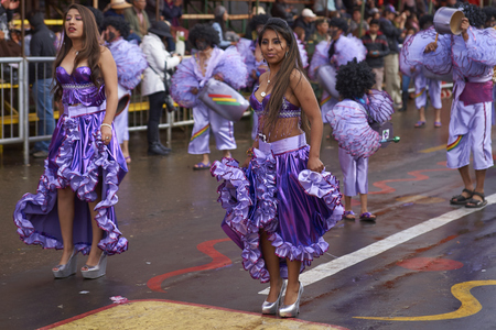 ORURO, BOLIVIA - FEBRUARY 25, 2017: Female dancers in colourful costumes parade through the mining city of Oruro on the Altiplano of Bolivia during the annual carnival.のeditorial素材