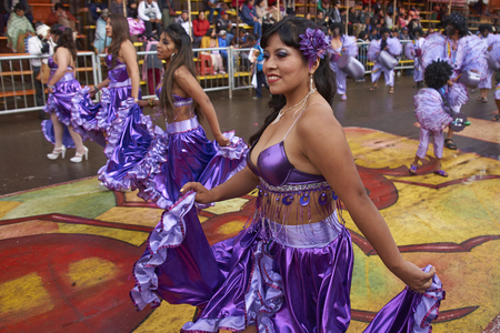 ORURO, BOLIVIA - FEBRUARY 25, 2017: Female dancers in colourful costumes parade through the mining city of Oruro on the Altiplano of Bolivia during the annual carnival.のeditorial素材
