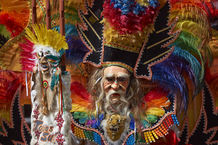 ORURO, BOLIVIA - FEBRUARY 25, 2017: Tobas dancers in colourful costumes performing at the annual Oruro Carnival. The event is designated by UNESCO as being Intangible Cultural Heritage of Humanity.のeditorial素材