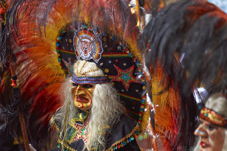 ORURO, BOLIVIA - FEBRUARY 25, 2017: Tobas dancers in colourful costumes performing at the annual Oruro Carnival. The event is designated by UNESCO as being Intangible Cultural Heritage of Humanity.のeditorial素材
