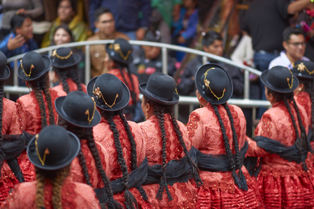 ORURO, BOLIVIA - FEBRUARY 25, 2017: Morenada dancers in ornate costumes parading through the mining city of Oruro on the Altiplano of Bolivia during the annual carnival.のeditorial素材