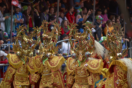ORURO, BOLIVIA - FEBRUARY 25, 2017: Masked Diablada dancers in ornate costumes parade through the mining city of Oruro on the Altiplano of Bolivia during the annual carnival.のeditorial素材