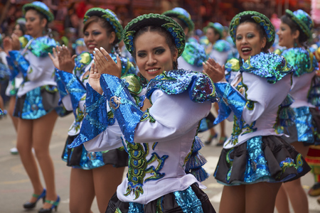 ORURO, BOLIVIA - FEBRUARY 26, 2017: Caporales dancers in ornate costumes performing as they parade through the mining city of Oruro on the Altiplano of Bolivia during the annual carnival.のeditorial素材