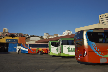 VALPARAISO, CHILE - July 14, 2017: Long distances coaches lined up in the main bus station in the UNESCO World Heritage City of Valparaiso in Chileのeditorial素材