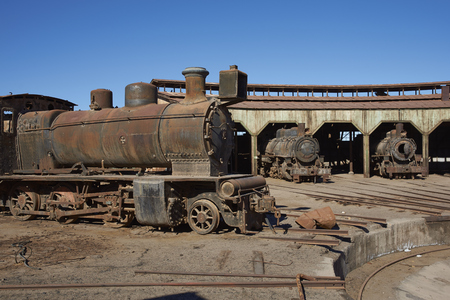 Baquedano, Antofagasta Region, Chile - August 19, 2017: Old steam locomotives at the historic engine shed at Baquedano Railway Station in the Atacama Desert, Chileのeditorial素材
