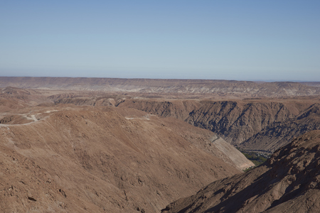 Large river canyon running through the Atacama Desert in the Arica y Parinacota Region of northern Chile.の写真素材
